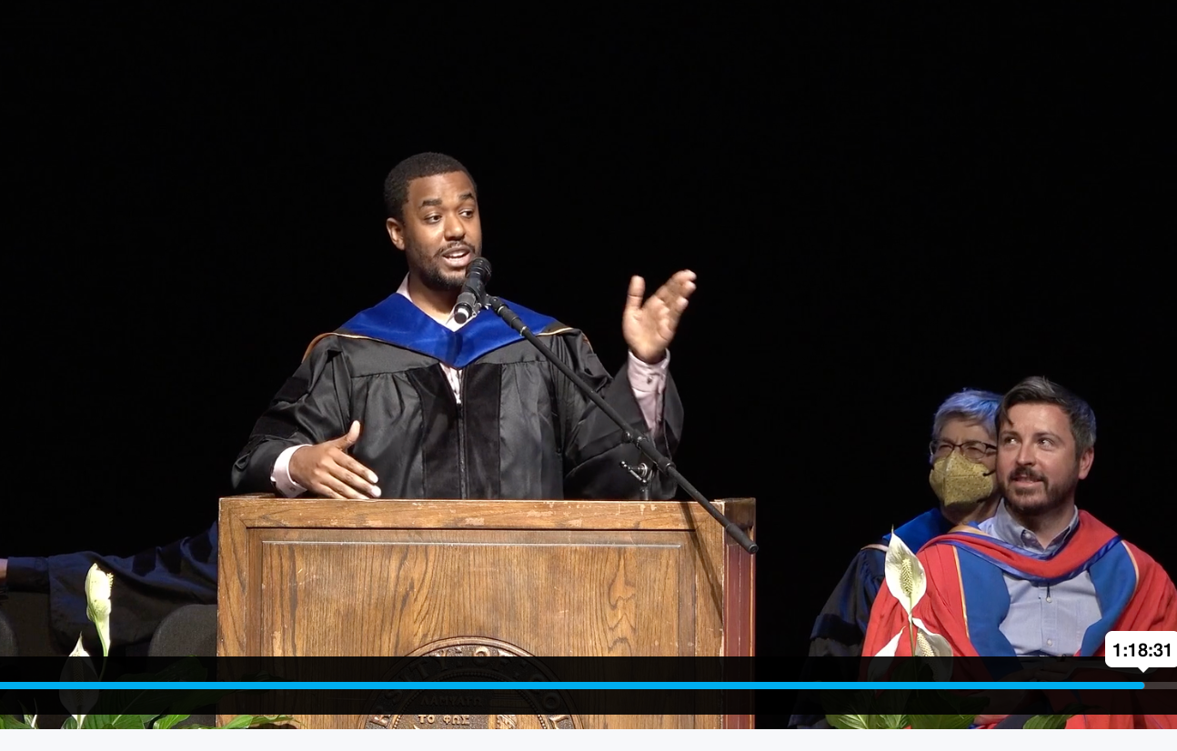Dr. Javan Carter speaking at an academic ceremony